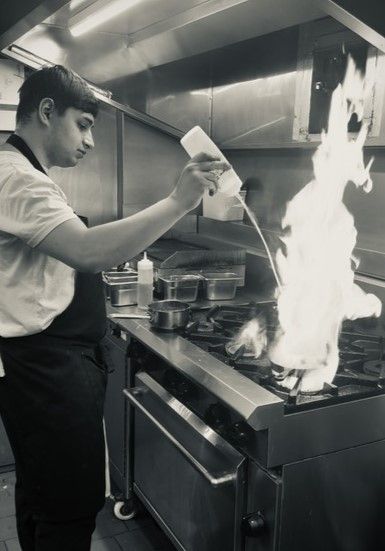 Professional Cookery student Bob Weston preparing a dish