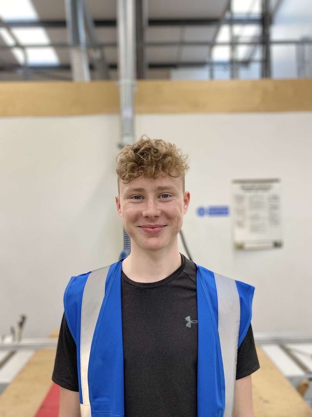 Jake Tipper smiling in construction uniform