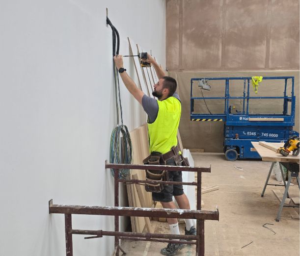 Leicester College student, Tom, in the campus workshop
