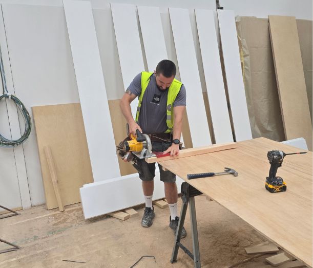 Leicester College student, Tom, in the campus workshop