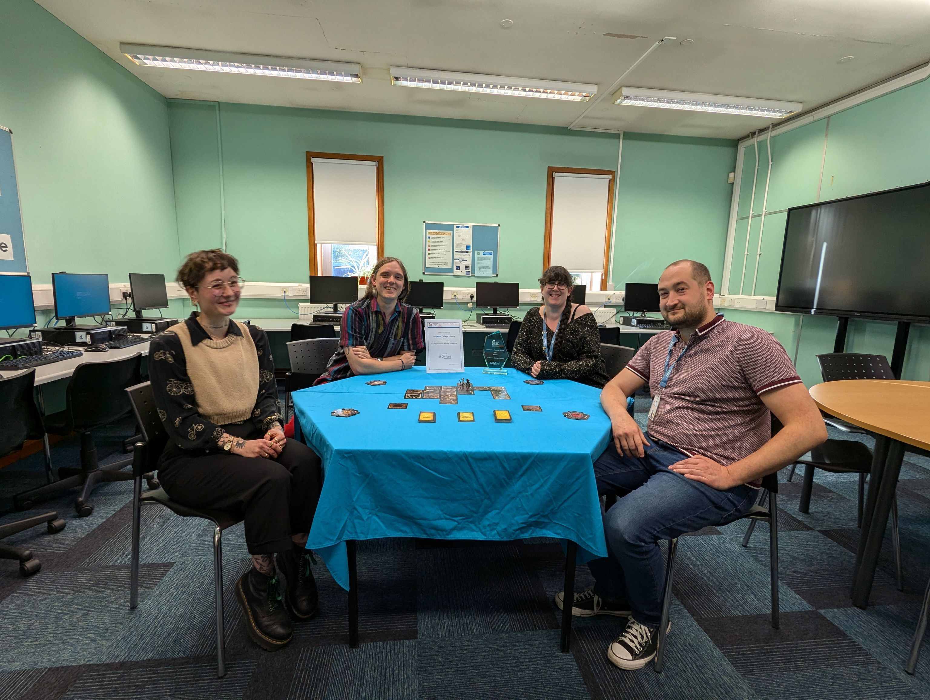 library staff sitting around the table showcasing gameracy