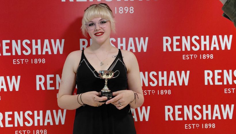 Leicester College student, Emily Carter holding her trophy at the Renshaw Cup