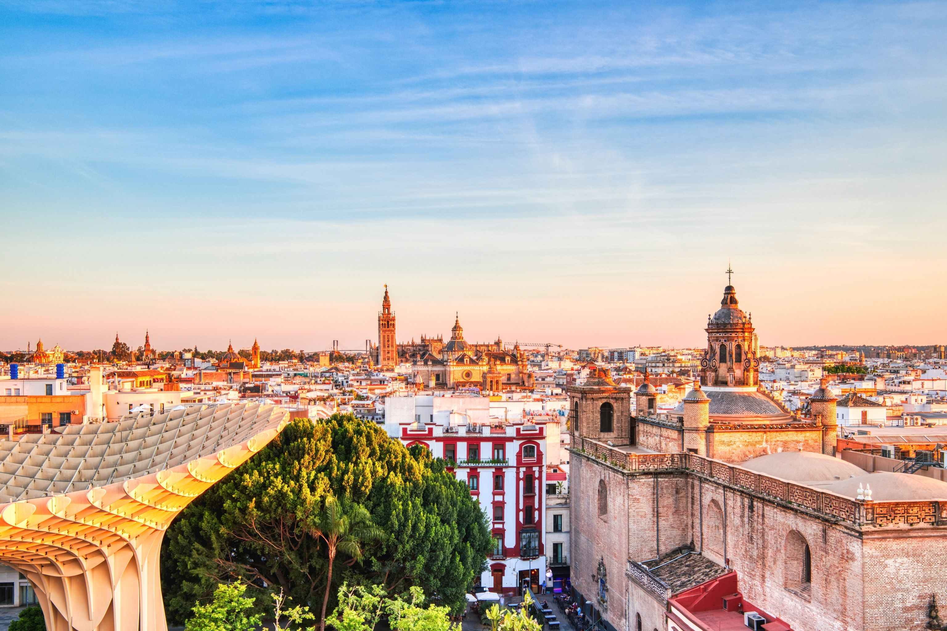 Seville City Skyline view with Space Metropol Parasol in the Foreground at Sunset, Seville, Spain