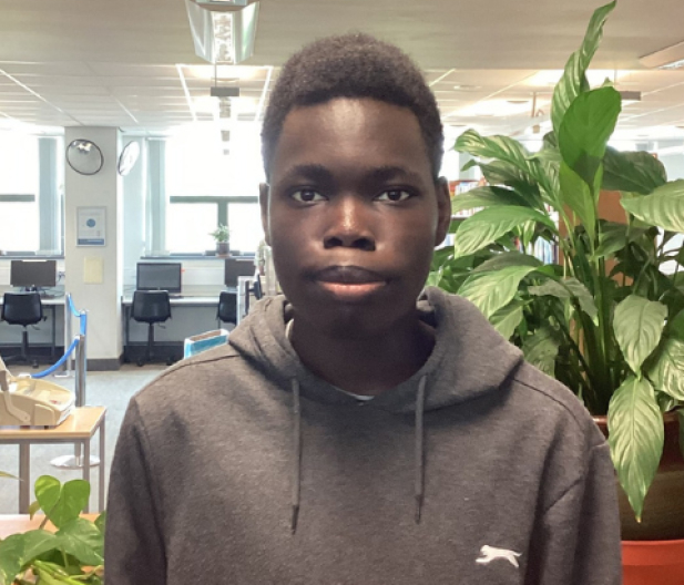 black student wearing a grey hoodie