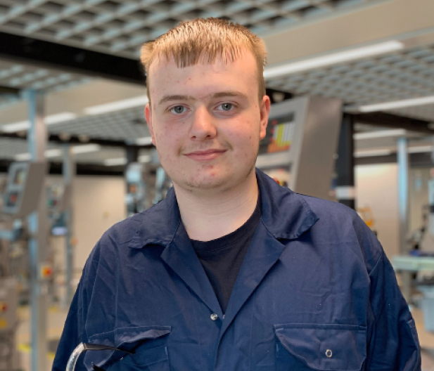 Engineering student wearing PPE navy overalls